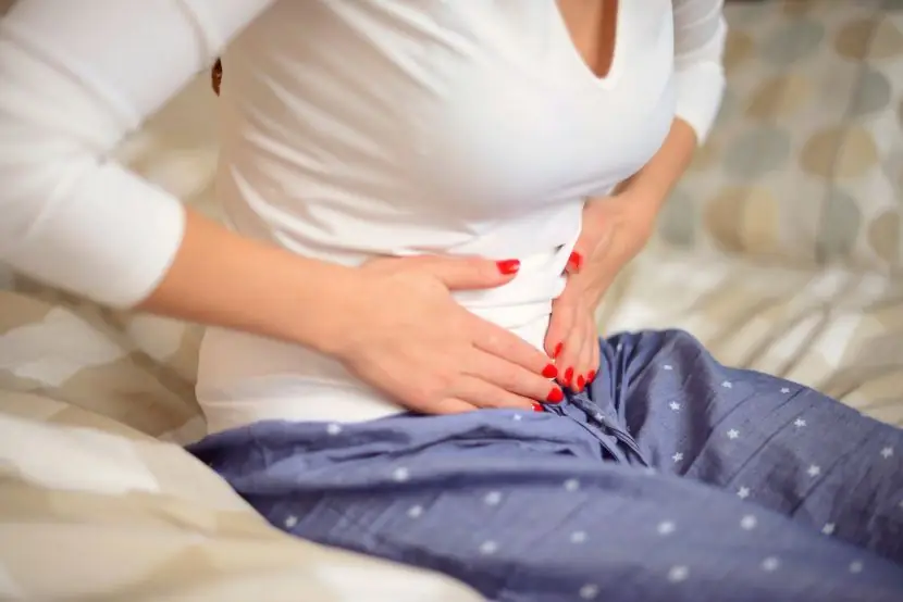 Woman holding her stomach