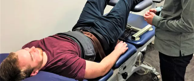 What is dry traction spinal traction and what is it used for